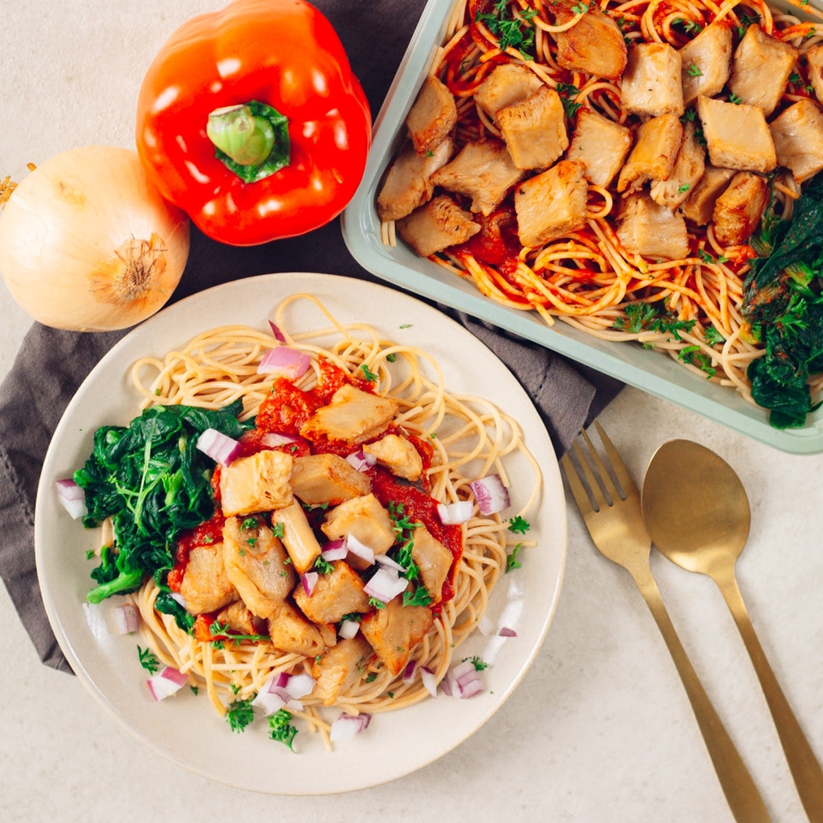 Spaghetti with tomato, spinach, and vegetarian chicken